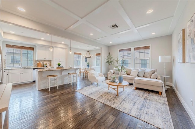 140 Full Moon, Irvine, CA 92618 - living area featuring dark wood-style floors, baseboards, plenty of natural light, coffered ceiling, and recessed lighting
