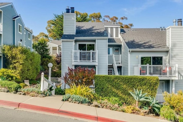 150 Cypress Ave Unit 28, Cayucos, CA 93430 - view of front facade with a chimney and a shingled roof
