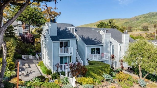 150 Cypress Ave Unit 28, Cayucos, CA 93430 - back of house with a chimney and a mountain view
