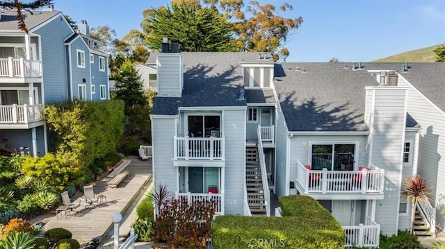 150 Cypress Ave Unit 28, Cayucos, CA 93430 - back of house with roof with shingles and a chimney