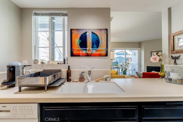 150 Cypress Ave Unit 28, Cayucos, CA 93430 - kitchen featuring a sink, white dishwasher, dishwasher, and light countertops