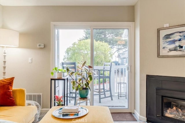 150 Cypress Ave Unit 28, Cayucos, CA 93430 - entryway with a glass covered fireplace and baseboards