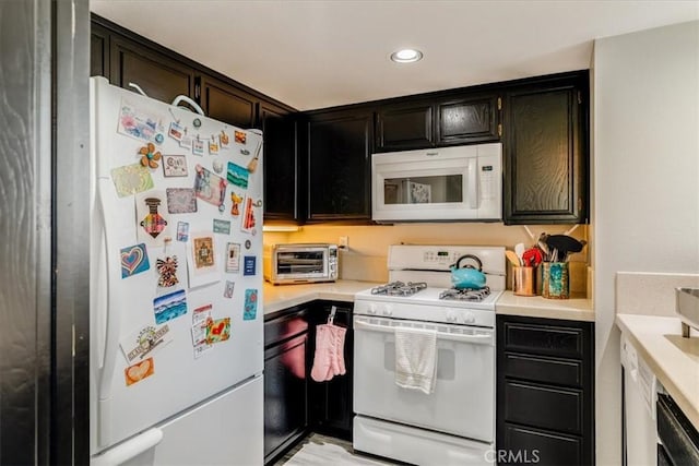 150 Cypress Ave Unit 28, Cayucos, CA 93430 - kitchen featuring white appliances, light countertops, and recessed lighting
