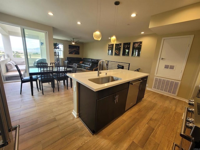 2072 Tango Loop Unit 2, Chula Vista, CA 91915 - kitchen featuring dishwasher, a sink, open floor plan, light countertops, and recessed lighting