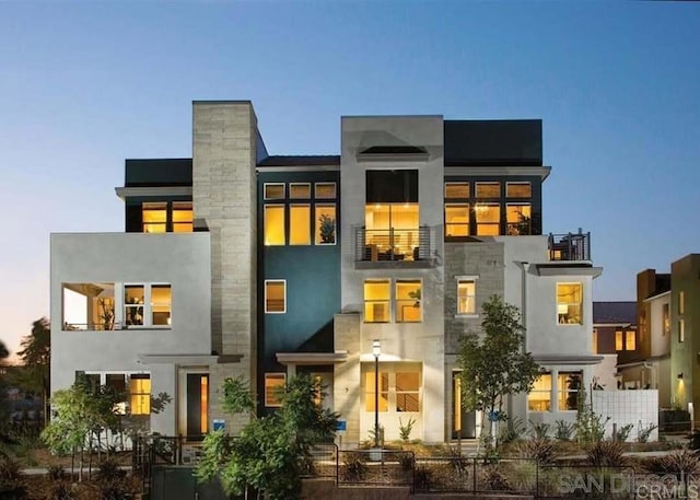 2072 Tango Loop Unit 2, Chula Vista, CA 91915 - back of property with a balcony and a fenced front yard