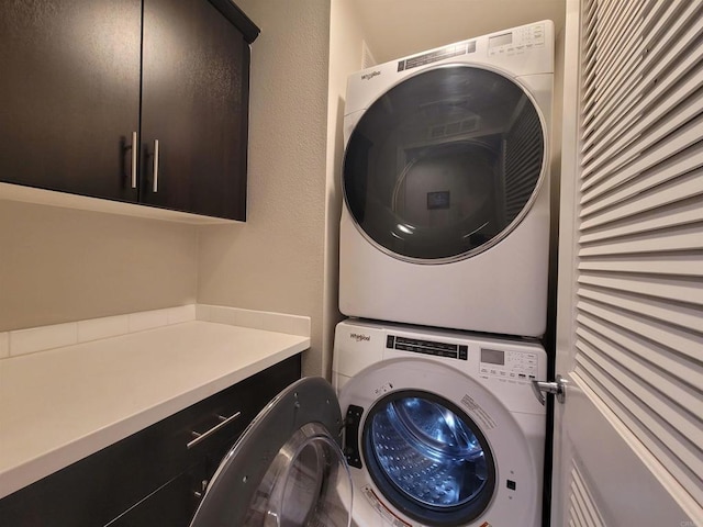 2072 Tango Loop Unit 2, Chula Vista, CA 91915 - laundry area with stacked washer / dryer and cabinet space