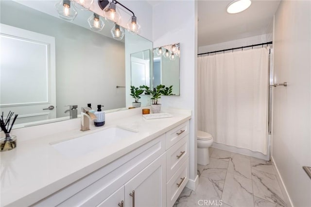 bathroom with marble finish floors, toilet, vanity, and baseboards