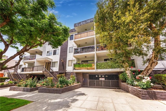 view of property featuring stairway