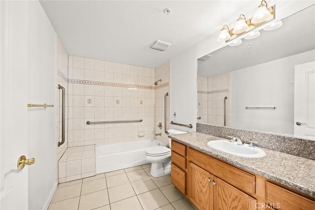 bathroom with tile patterned floors, toilet, bathing tub / shower combination, and vanity