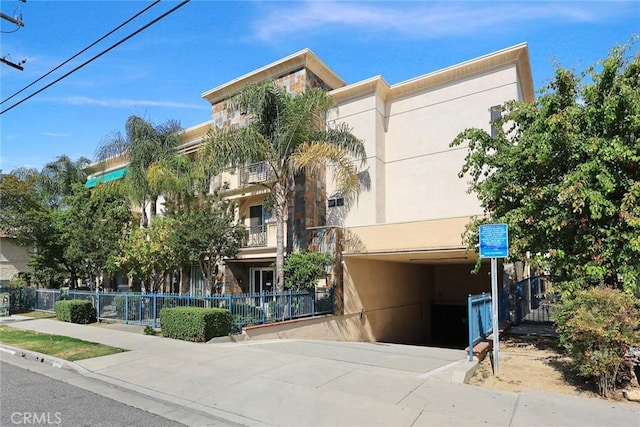 view of building exterior featuring fence