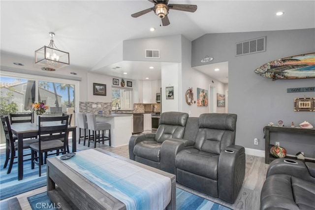 37 Fleurance St, Laguna Niguel, CA 92677 - living room featuring vaulted ceiling, ceiling fan, recessed lighting, a chandelier, and light wood-style floors