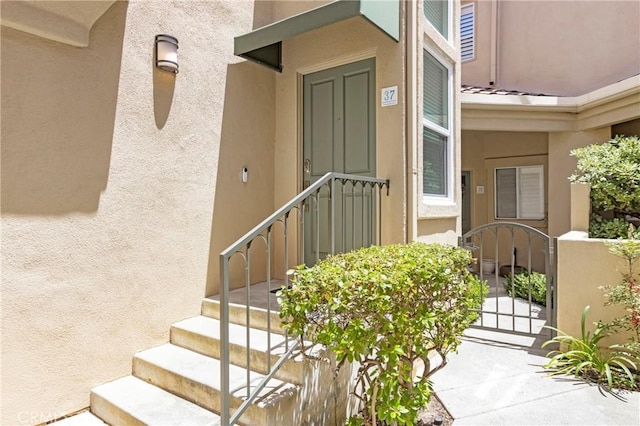 37 Fleurance St, Laguna Niguel, CA 92677 - view of exterior entry featuring stucco siding and a gate