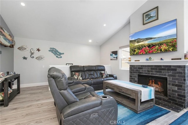 37 Fleurance St, Laguna Niguel, CA 92677 - living room with wood finished floors, lofted ceiling, a fireplace, recessed lighting, and baseboards