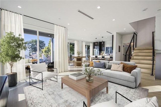 2202 Thurman Ave, Los Angeles, CA 90016 - living area with wood finished floors, stairway, and recessed lighting