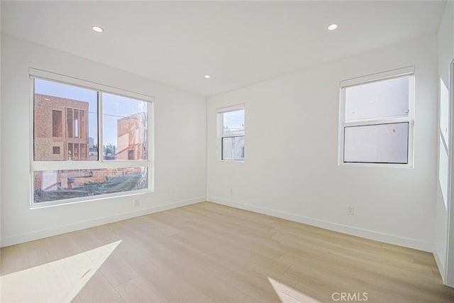 2202 Thurman Ave, Los Angeles, CA 90016 - unfurnished room featuring light wood finished floors, baseboards, and recessed lighting