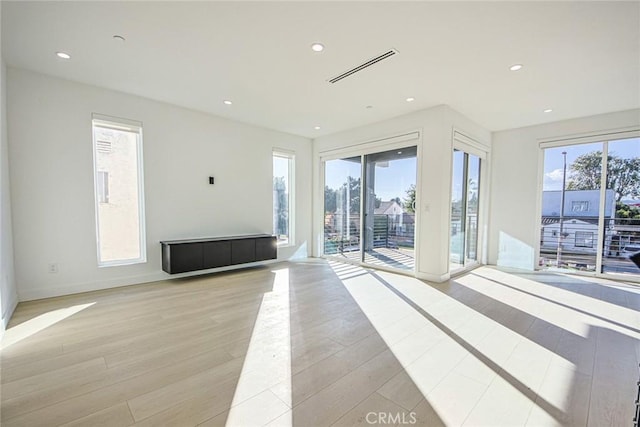2202 Thurman Ave, Los Angeles, CA 90016 - unfurnished living room featuring light wood-style flooring, recessed lighting, and baseboards