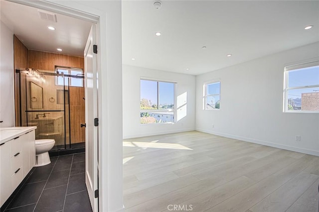 2202 Thurman Ave, Los Angeles, CA 90016 - bathroom featuring vanity, toilet, recessed lighting, wood finished floors, and baseboards