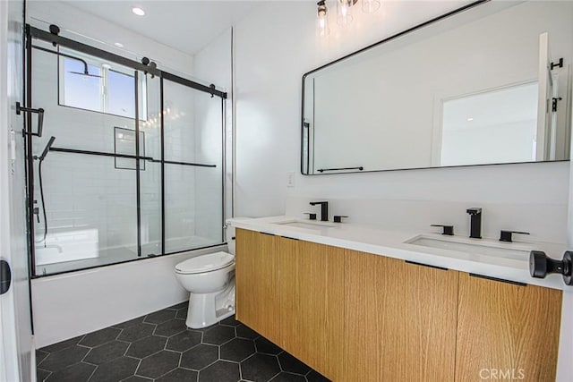 2202 Thurman Ave, Los Angeles, CA 90016 - bathroom featuring tile patterned flooring, toilet, combined bath / shower with glass door, double vanity, and recessed lighting
