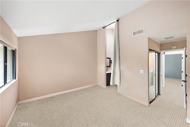 12750 Centralia St Unit 215, Lakewood, CA 90715 - spare room featuring baseboards and light colored carpet