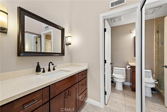 12750 Centralia St Unit 215, Lakewood, CA 90715 - bathroom with toilet, vanity, tile patterned flooring, and baseboards