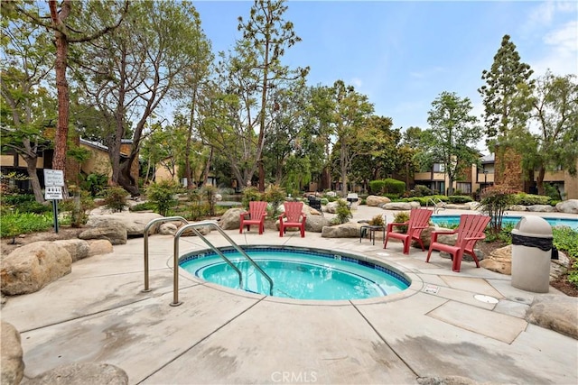 12750 Centralia St Unit 215, Lakewood, CA 90715 - view of pool featuring a pool and a patio area
