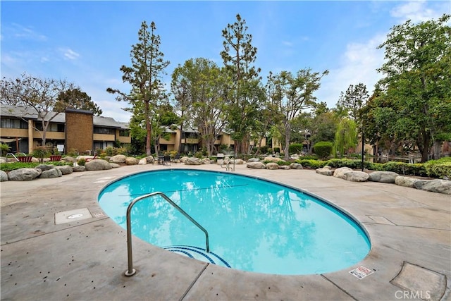 12750 Centralia St Unit 215, Lakewood, CA 90715 - community pool featuring a residential view and a patio area