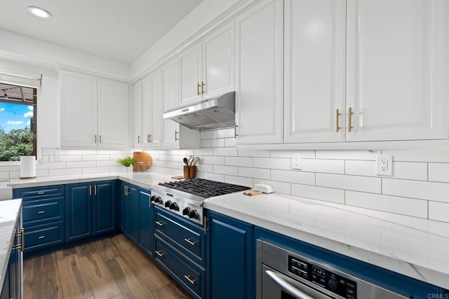 34056 Vandale Ct, Temecula, CA 92592 - kitchen featuring appliances with stainless steel finishes, blue cabinets, under cabinet range hood, white cabinetry, and recessed lighting