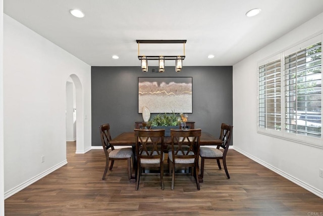 34056 Vandale Ct, Temecula, CA 92592 - dining room featuring arched walkways, wood finished floors, recessed lighting, and baseboards