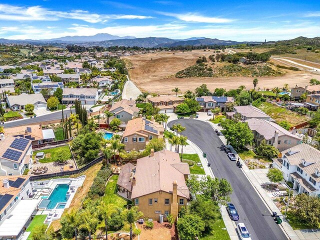 34056 Vandale Ct, Temecula, CA 92592 - aerial perspective of suburban area featuring a pool and a mountainous background