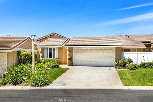 33441 N Spinnaker Dr N, Dana Point, CA 92629 - ranch-style house with a garage, driveway, a tile roof, and fence