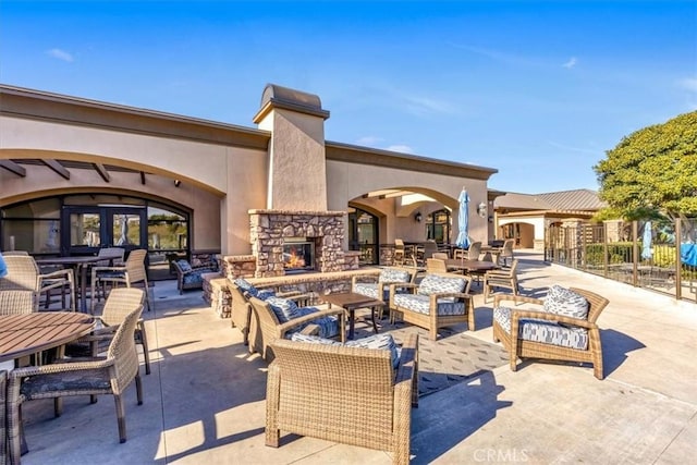 33441 N Spinnaker Dr N, Dana Point, CA 92629 - view of patio / terrace with an outdoor living space with a fireplace and outdoor dining area