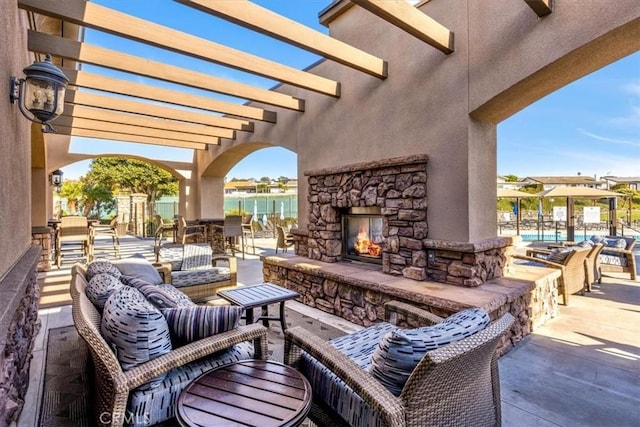 33441 N Spinnaker Dr N, Dana Point, CA 92629 - view of patio featuring an outdoor stone fireplace and a pergola