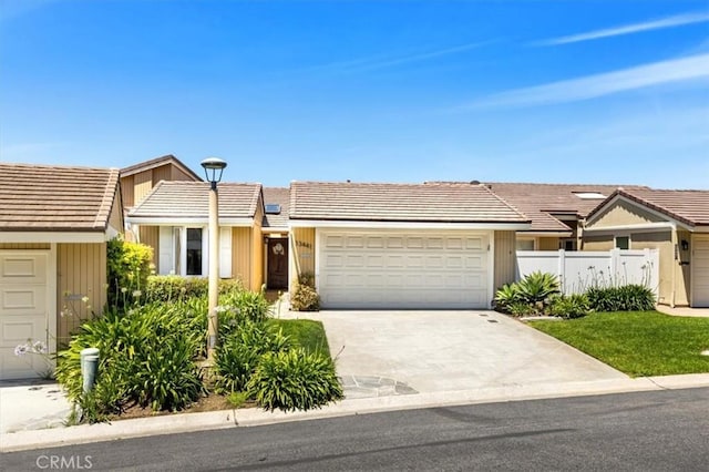 33441 N Spinnaker Dr N, Dana Point, CA 92629 - view of front of home with a garage, fence, driveway, and a tile roof