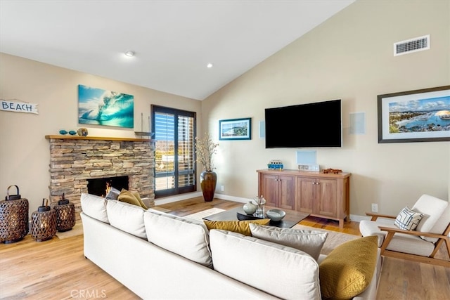 33441 N Spinnaker Dr N, Dana Point, CA 92629 - living room featuring high vaulted ceiling, light wood-style floors, baseboards, a fireplace, and recessed lighting