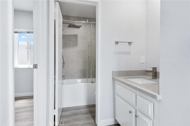 72 S Greenwood Ave Unit 3, Pasadena, CA 91107 - bathroom featuring vanity, wood finished floors, and combined bath / shower with glass door