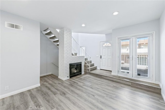 72 S Greenwood Ave Unit 3, Pasadena, CA 91107 - unfurnished living room featuring light wood-type flooring, baseboards, recessed lighting, and a fireplace
