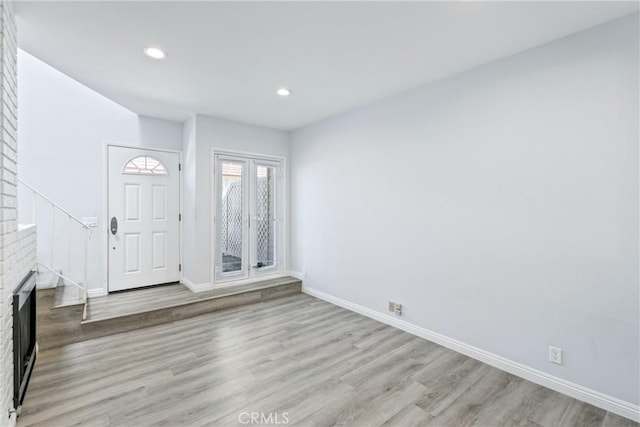 72 S Greenwood Ave Unit 3, Pasadena, CA 91107 - entrance foyer featuring baseboards, light wood-style floors, recessed lighting, and a fireplace