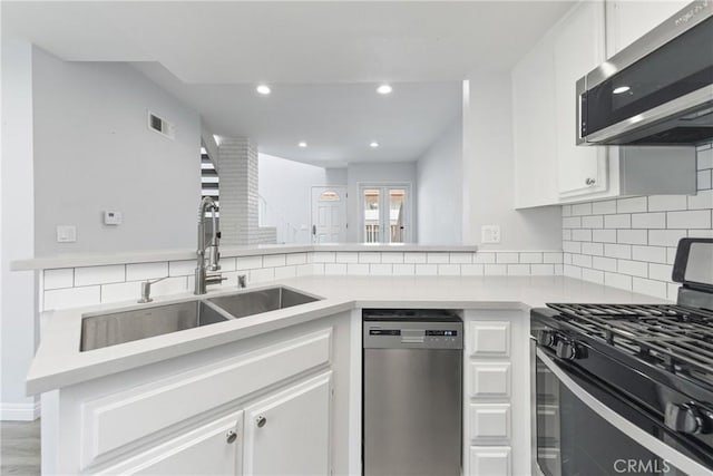 72 S Greenwood Ave Unit 3, Pasadena, CA 91107 - kitchen with appliances with stainless steel finishes, a sink, backsplash, light countertops, and recessed lighting