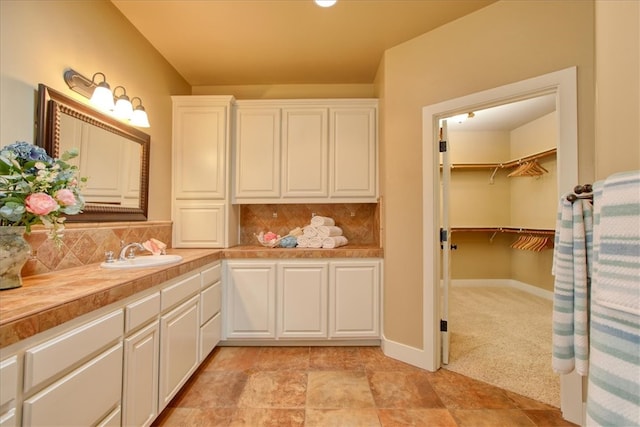 7550 Mary Hall Rd, Arroyo Grande, CA 93420 - full bathroom with decorative backsplash, vanity, and a walk in closet