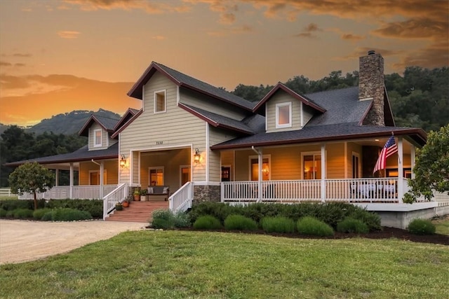 7550 Mary Hall Rd, Arroyo Grande, CA 93420 - farmhouse-style home featuring a porch, a chimney, and a front lawn