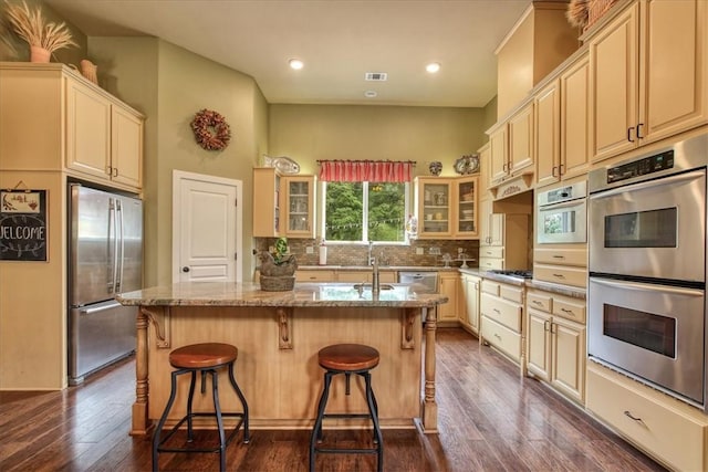 7550 Mary Hall Rd, Arroyo Grande, CA 93420 - kitchen featuring stainless steel appliances, light stone counters, glass insert cabinets, backsplash, and cream cabinets