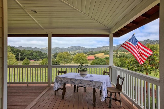 7550 Mary Hall Rd, Arroyo Grande, CA 93420 - wooden deck with a mountain view, a lawn, and outdoor dining area