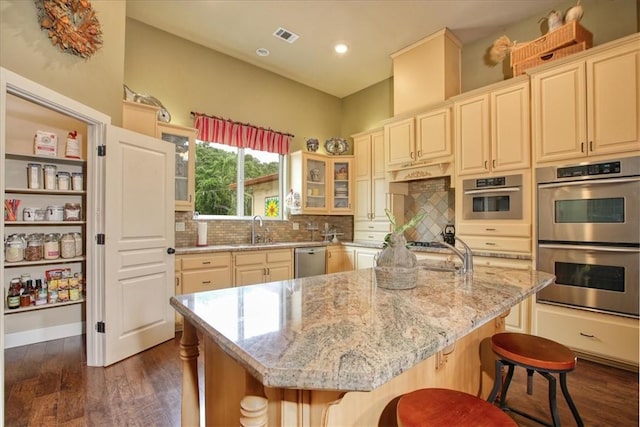 7550 Mary Hall Rd, Arroyo Grande, CA 93420 - kitchen with appliances with stainless steel finishes, a sink, dark wood-type flooring, decorative backsplash, and light stone countertops