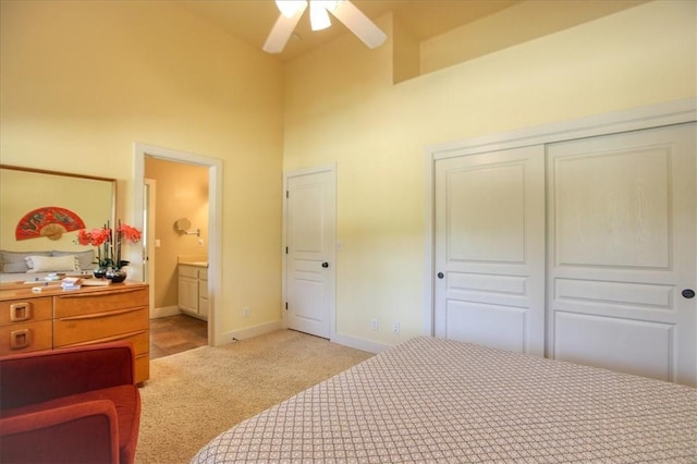 7550 Mary Hall Rd, Arroyo Grande, CA 93420 - bedroom featuring a towering ceiling, light colored carpet, baseboards, a closet, and connected bathroom