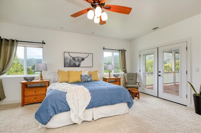 7550 Mary Hall Rd, Arroyo Grande, CA 93420 - carpeted bedroom featuring access to exterior, french doors, multiple windows, and ceiling fan