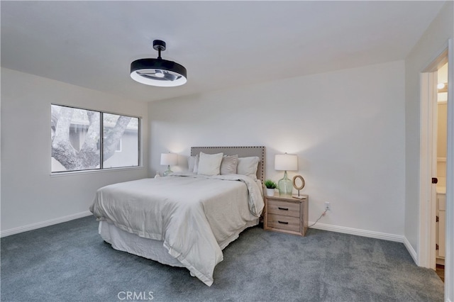 carpeted bedroom featuring baseboards