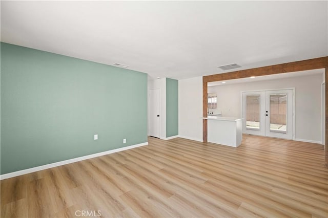 3316 Roxbury St, Rosamond, CA 93505 - spare room featuring french doors and light wood-type flooring