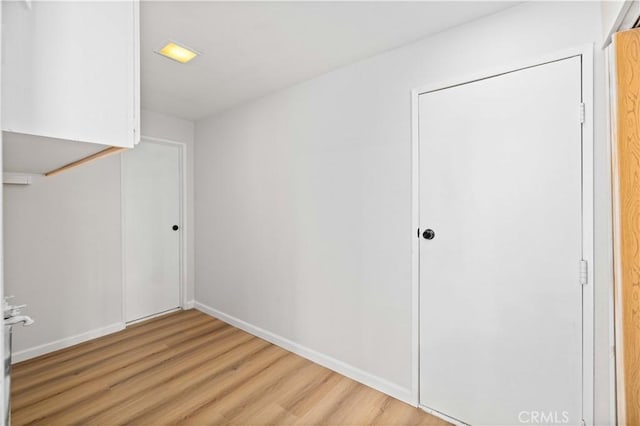 3316 Roxbury St, Rosamond, CA 93505 - unfurnished bedroom with light wood-type flooring and baseboards