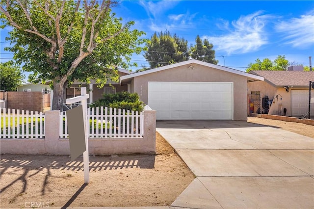 3316 Roxbury St, Rosamond, CA 93505 - single story home with an attached garage, concrete driveway, stucco siding, and fence