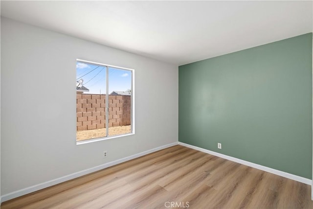 3316 Roxbury St, Rosamond, CA 93505 - unfurnished room with wood finished floors and baseboards